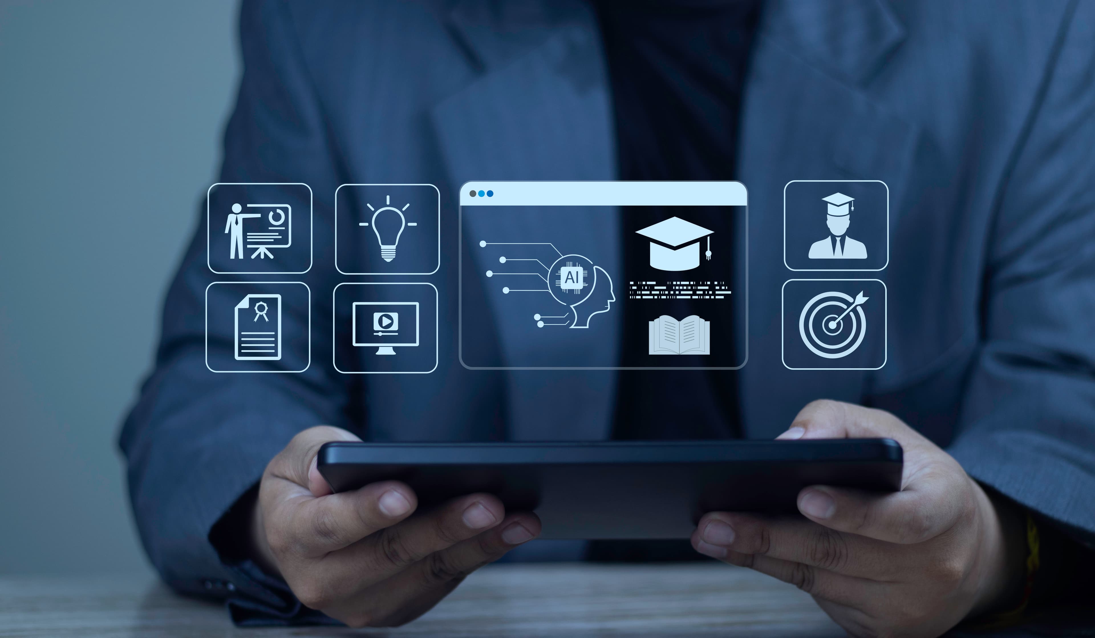 Business user holding a tablet with AI education and corporate training icons